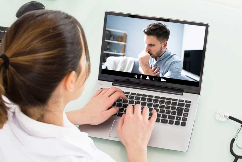 doctor meets with veteran via laptop
