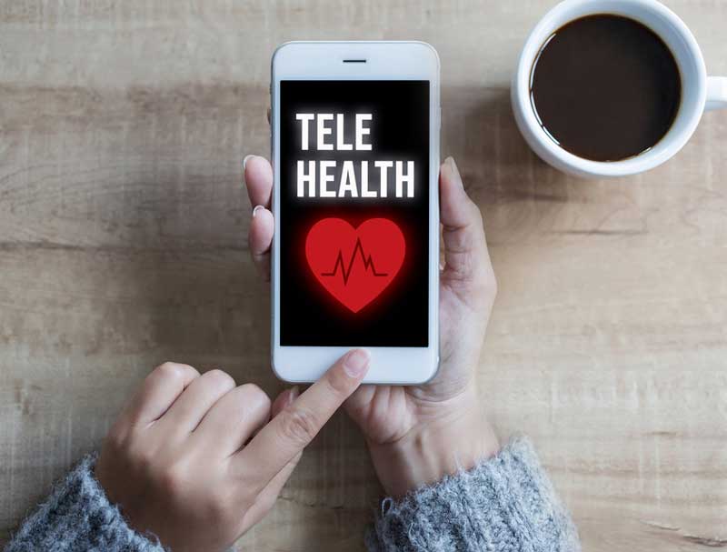 woman ends telehealth session on iphone