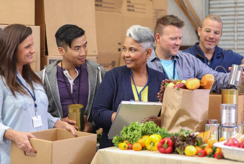 Veterans who volunteer with faith-based organizations often perform community service at locations like food banks.